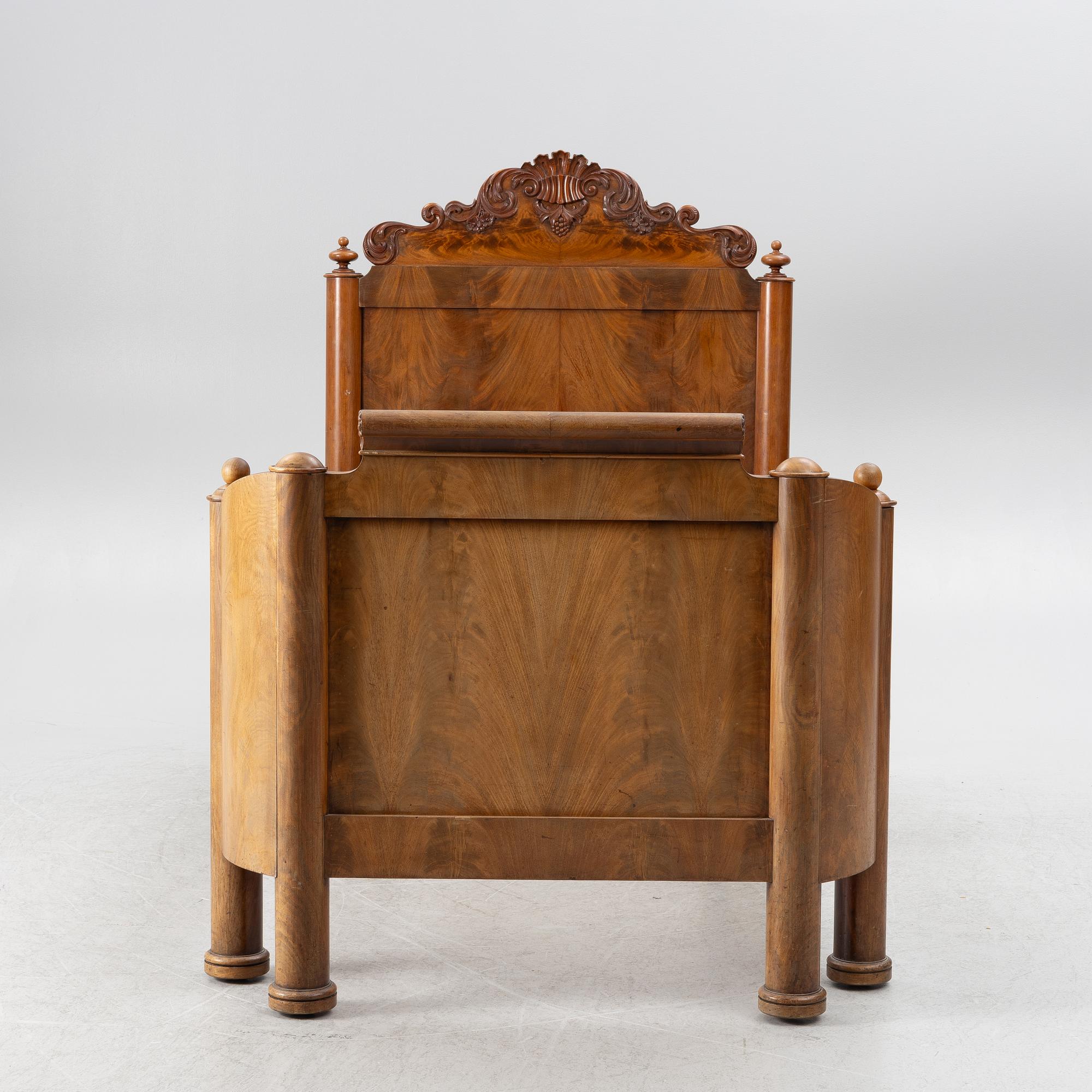 A late Empire bed, mid-19th century.