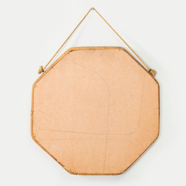 A 1950s rattan mirror.