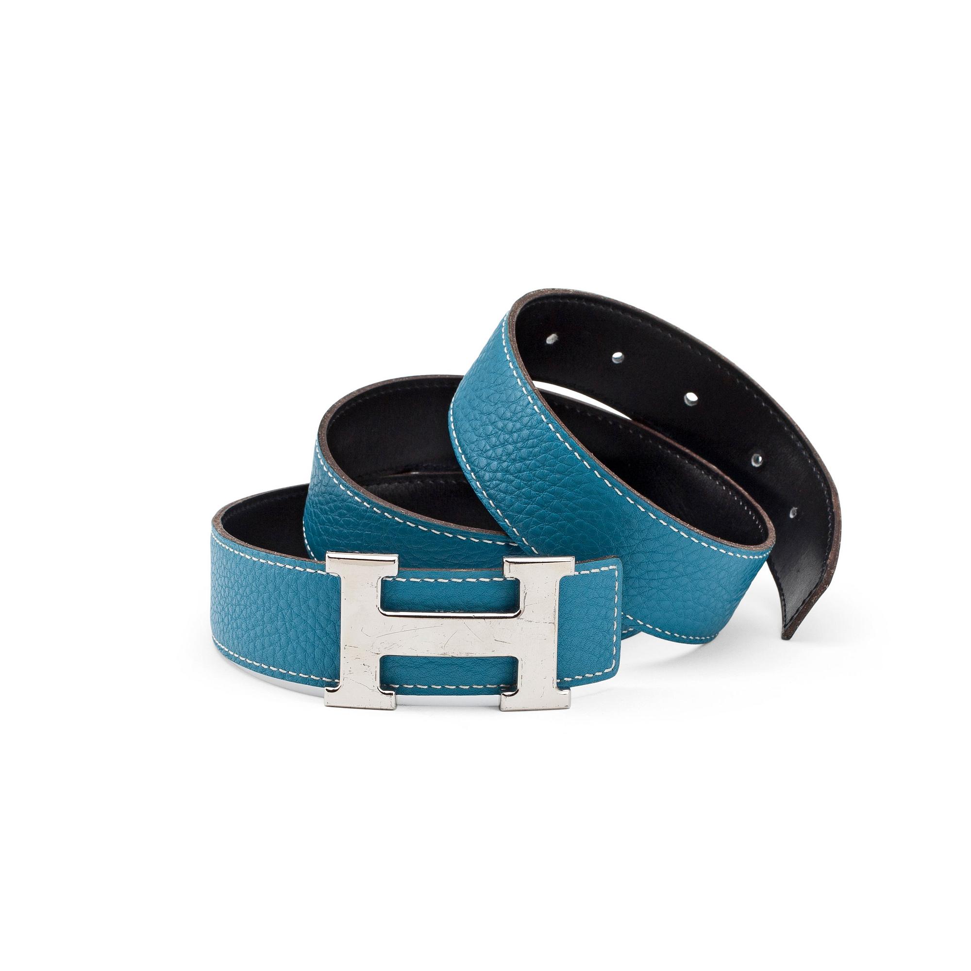 HERMÈS, a reversible belt, blue and brown with silver colored H belt buckle.