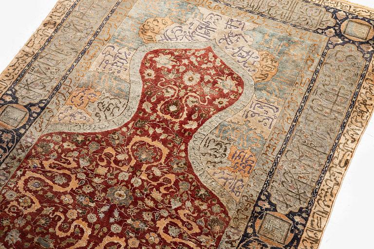 An antique silk rug, probably Istanbul, Turkey, c. 181 x 127 cm.