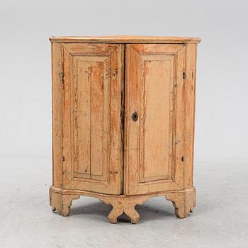 A Swedish Rococo corner cabinet, 18th Century.