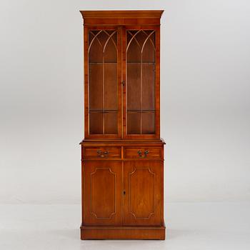 An English yew cabinet, 21st Century.