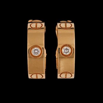 65. A pair of Cartier 'Love earrings' with brilliant-cut diamonds, total carat weight circa 0.10 ct.