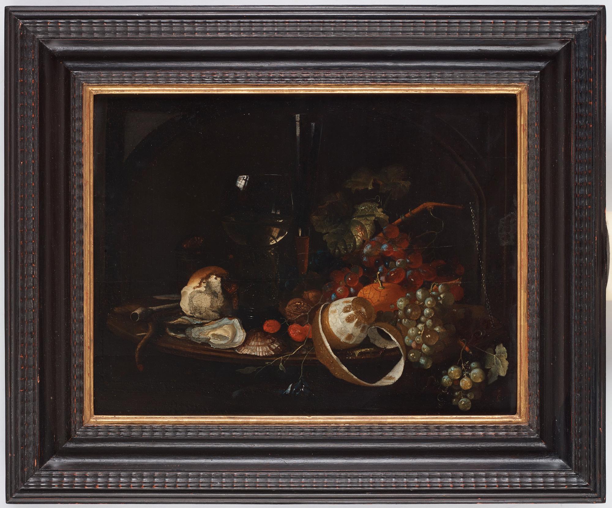 Willem Kalf In the manner of the artist, Still life with oysters, wine glass, clay pipe, fruits and insects.