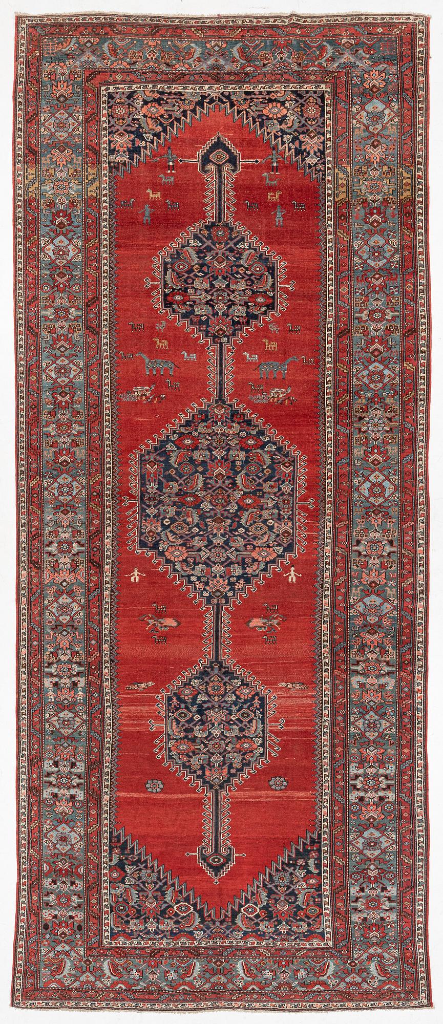 A Malayer runner, west Persia, c. 560 x 200 cm.