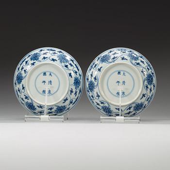 A pair of blue and white lotus dishes, Qing dynasty (1644-1912) with Kangxi six characters mark.