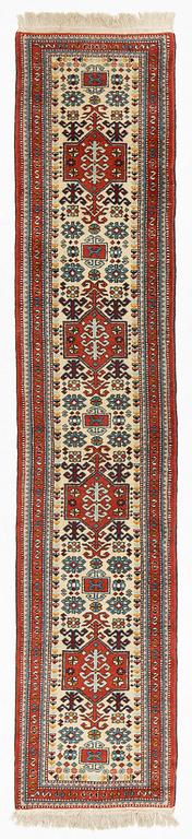 An oriental runner, c. 355 x 75 cm.