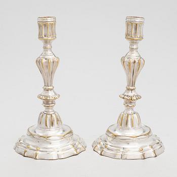 A pair of mid 18th century brass, argent haché, candlesticks, France.