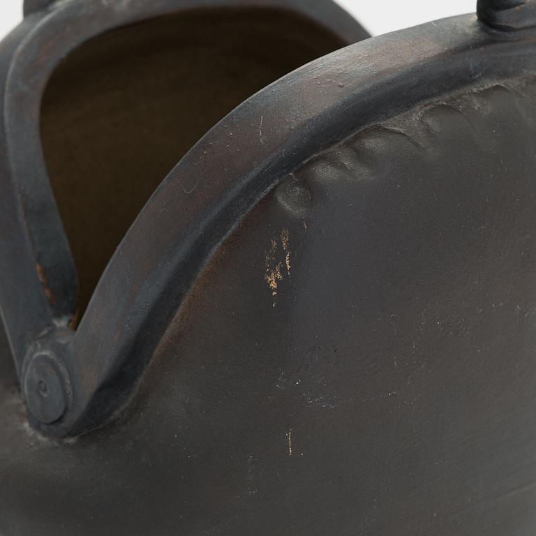 Outi Leinonen, a ceramic vase formed as a purse for Pentik, Finland.