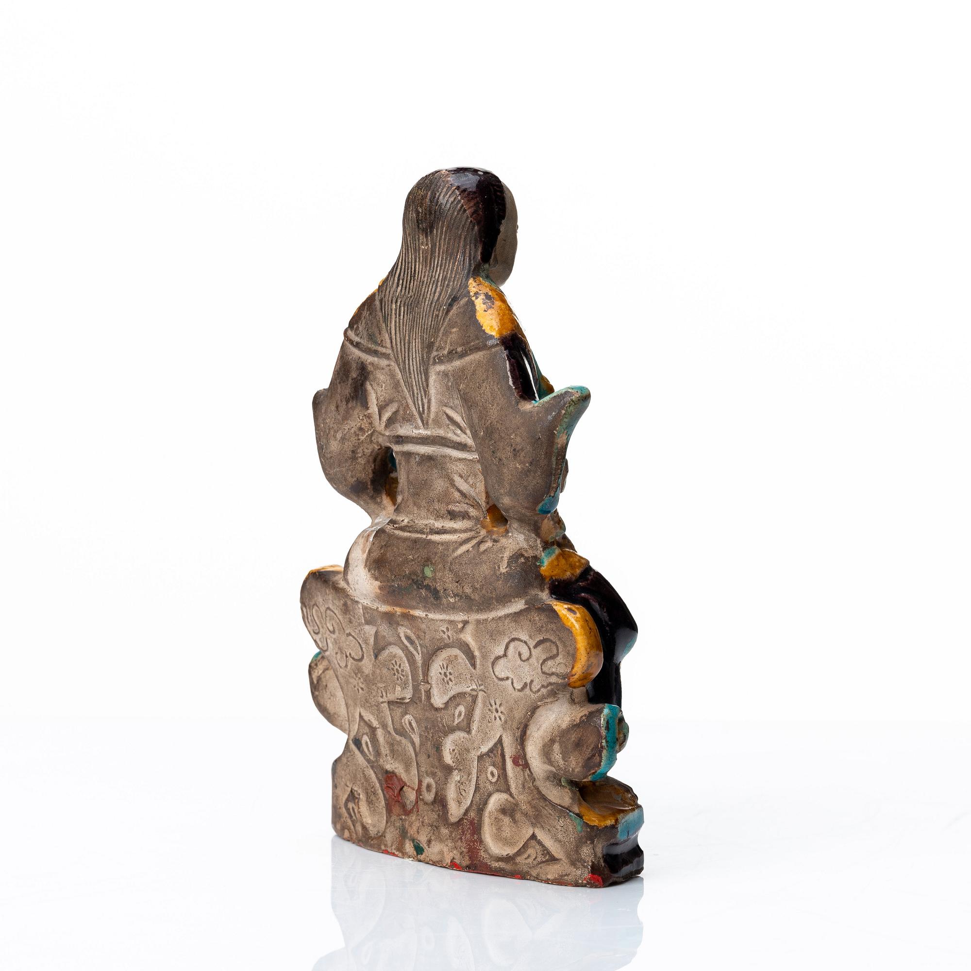 A pottery figure of a the warrior god Guandi, Ming dynasty (1368-1644).