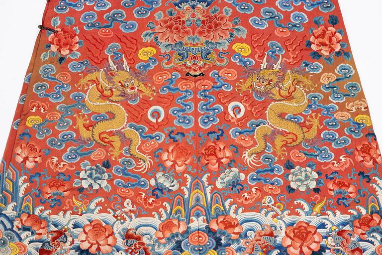 An embroidered red ground five clawed dragon 'female' formal robe, Qing dynasty, 19th century.