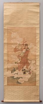 A hanging scroll depicting a man/musician in a landscape. 20th century.