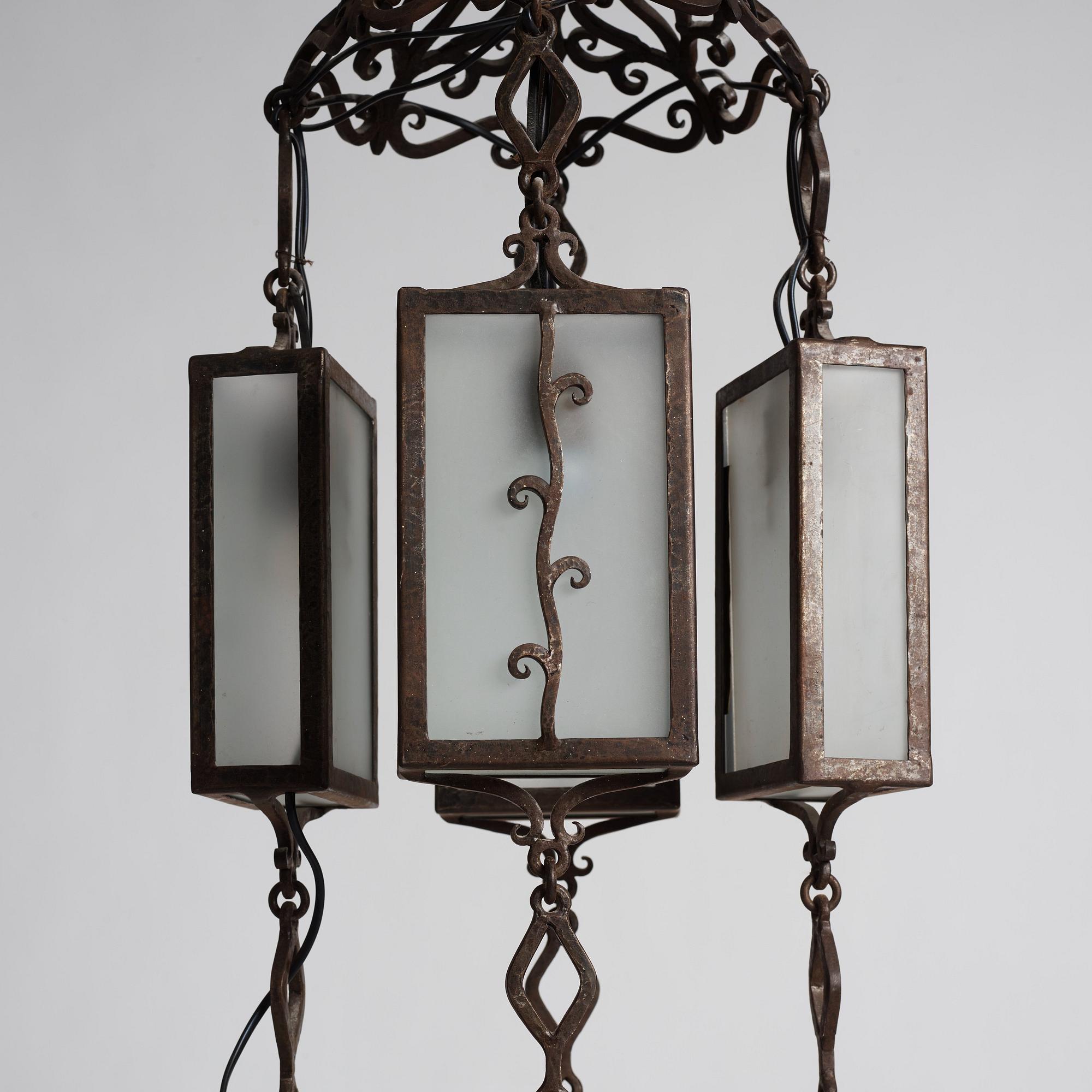 Carl Westman, attributed to, a wrought iron and frosted glass Art Nouveau chandelier, Sweden ca 1915.