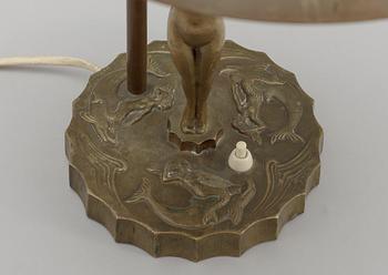 A bronze table lamp.