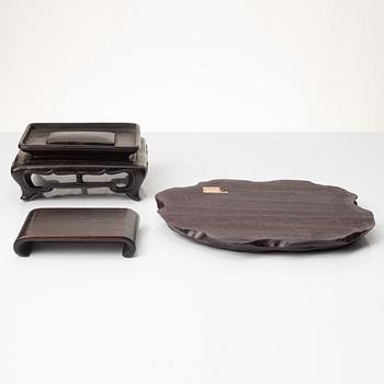 A group of Chinese hardwood stands and a cover, Qing dynasty and later.