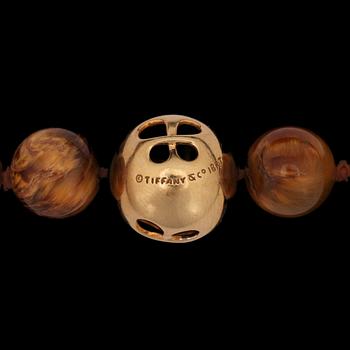 A Tiffany & Co Angela Cummings necklace with tigers eye quartz and gold clasp.