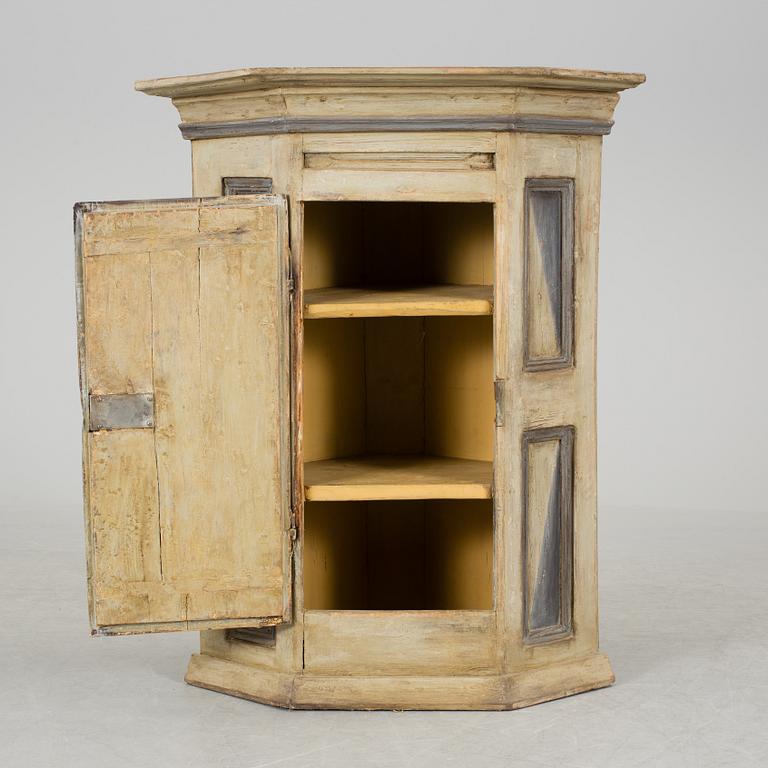 A 18th century corner cabinet.