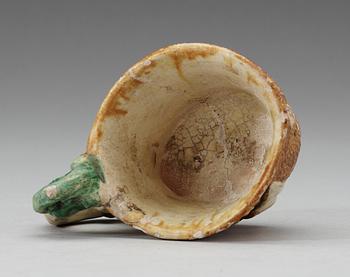 A green white and yellow glazed rhyton ewer, Tang dynasty (618-907).