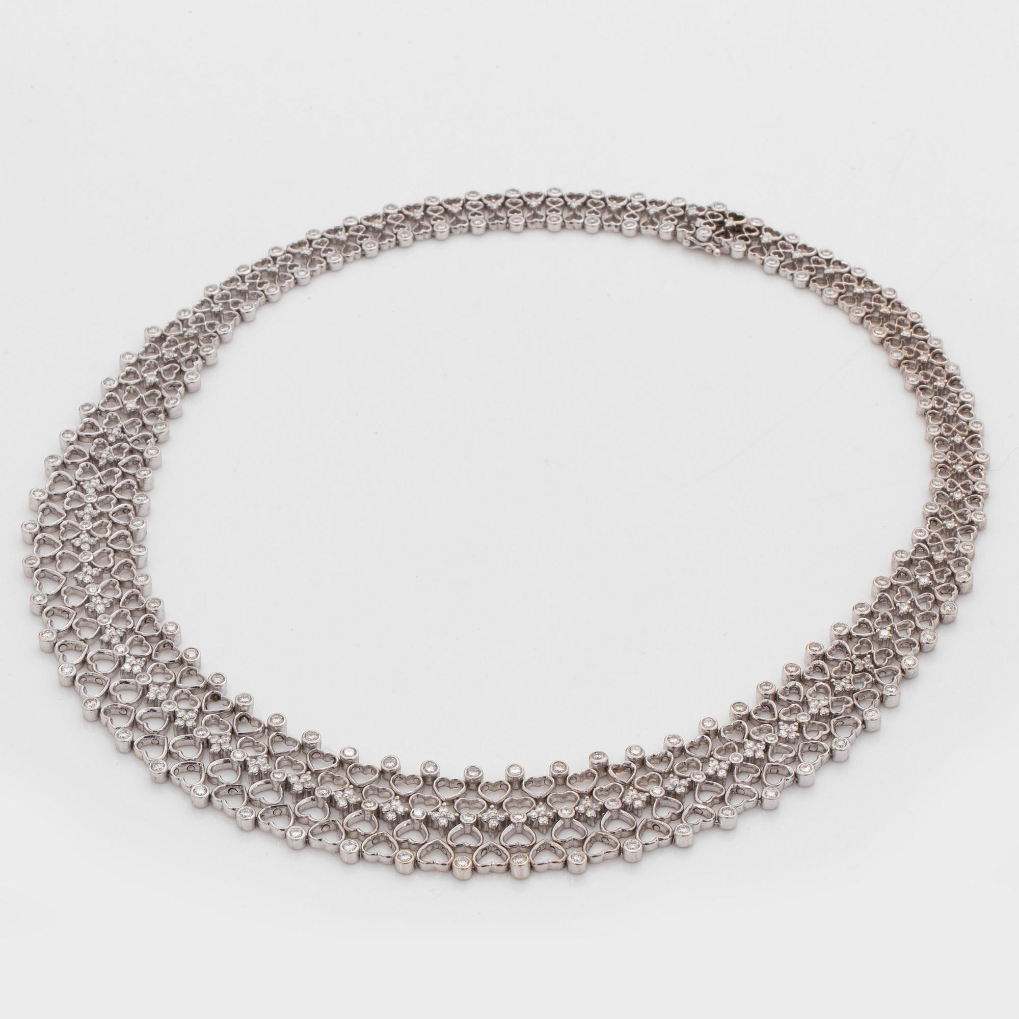 A brilliant cut diamond necklace. Total carat weight of diamonds circa 6.00 cts.