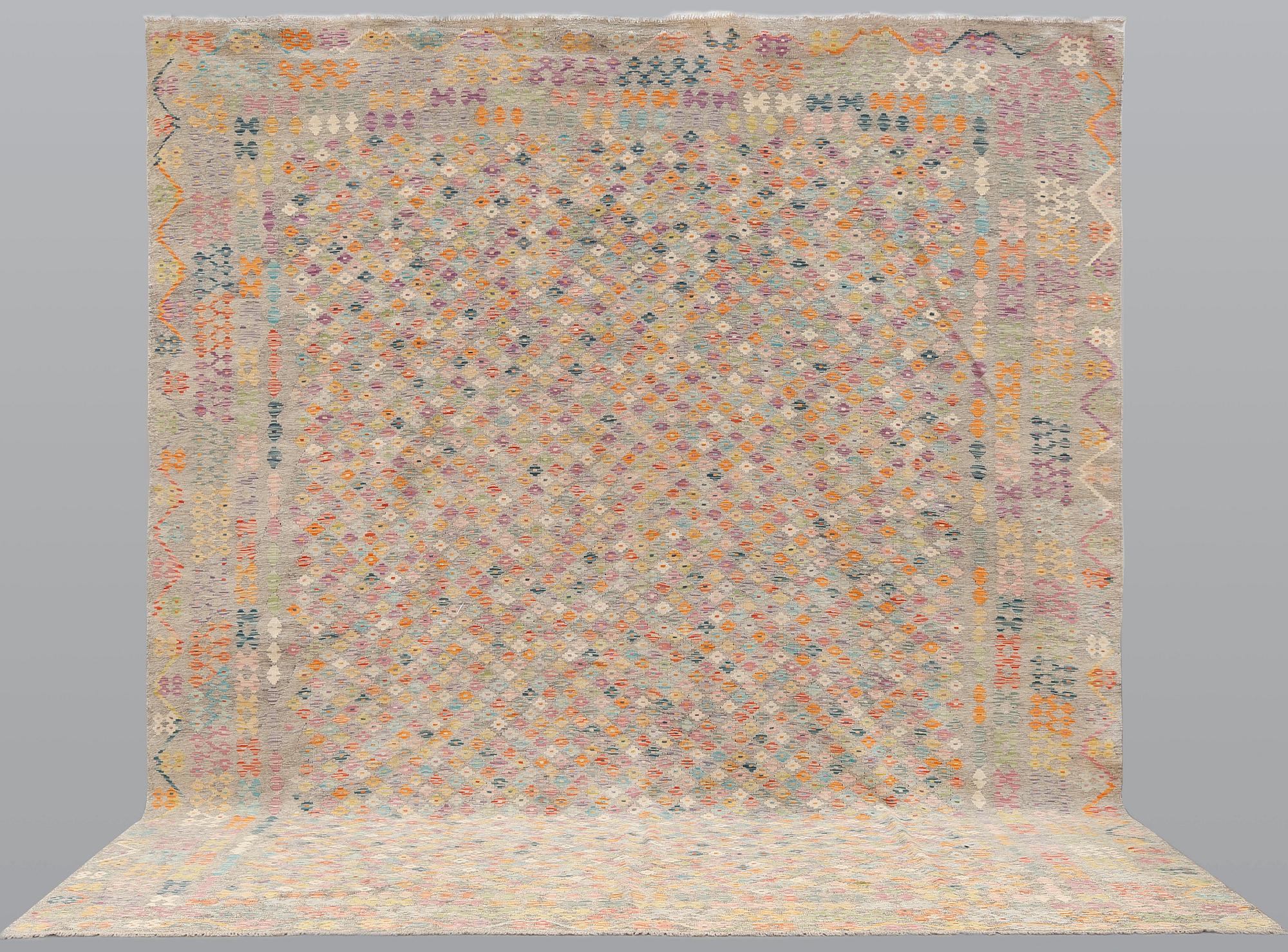 A Kilim carpet, approx. 432 x 368 cm.