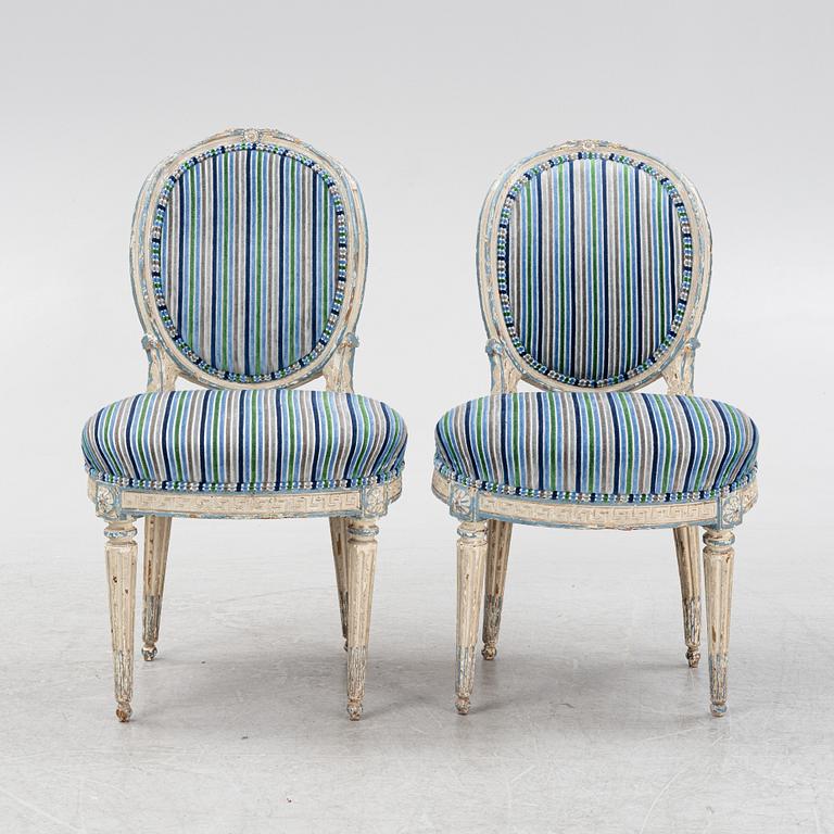 A painted pair of Louis XVI style chairs, 18th Century.