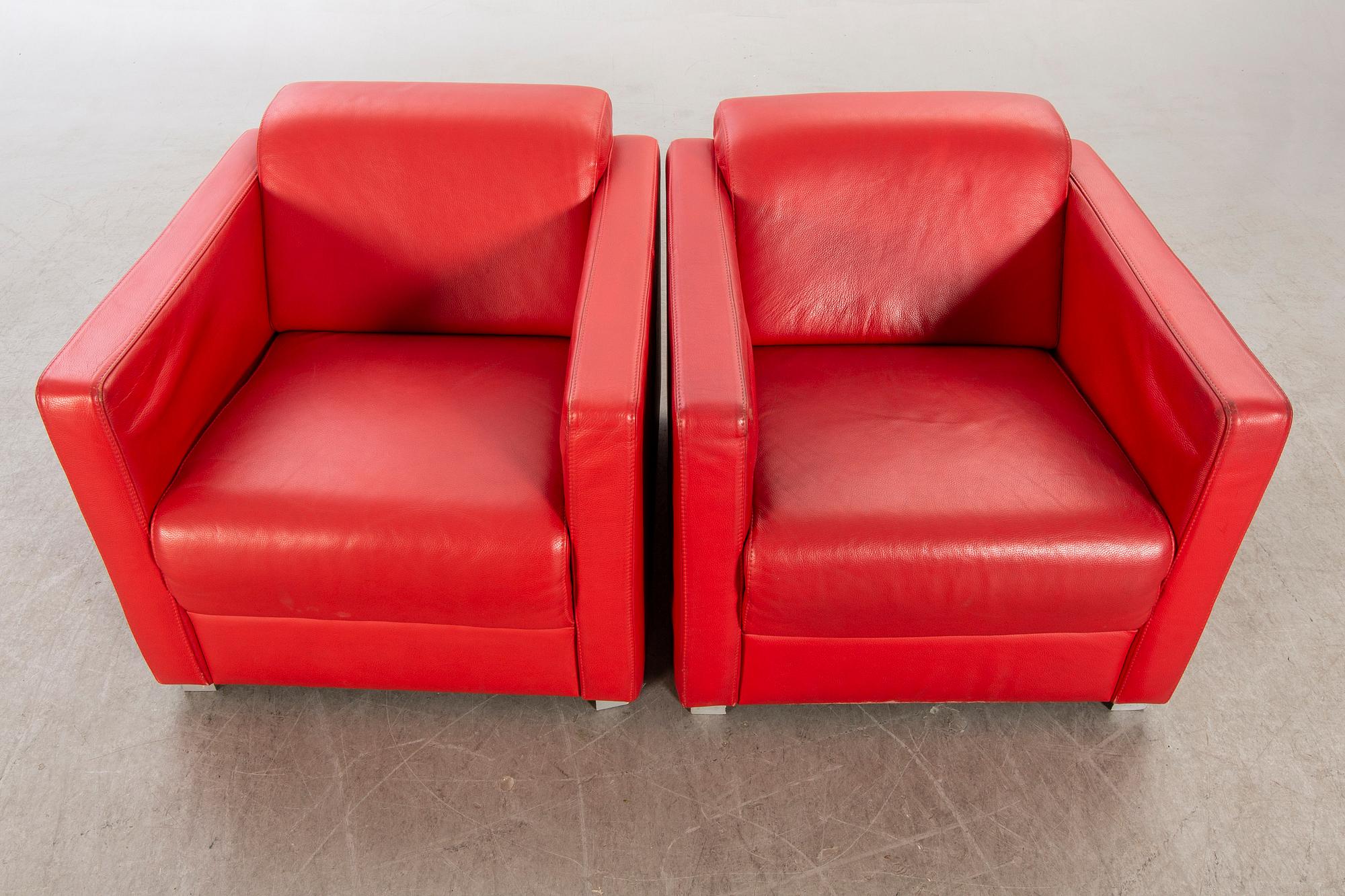 A pair of Italian 1990's leather armchairs.