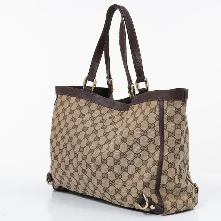 Gucci, a canvas and leather bag.