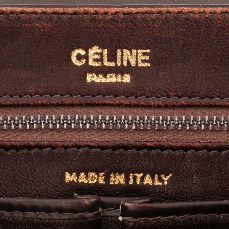 CÉLINE, a brown crocodile evening bag / shoulder bag with  shoulder strap.