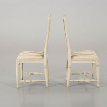 A piar of signed Swedish Gustavian chairs.