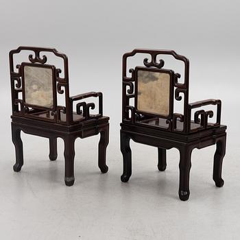 A pair of hardwood chairs and a table, China, 20th century.