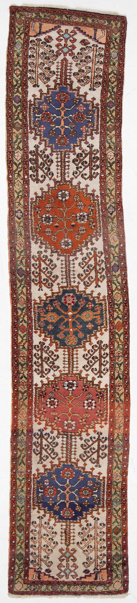 An oriental runner, c. 395 x 82 cm.