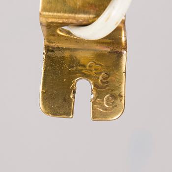 A mid-20th century wall light for Valinte, Finland.