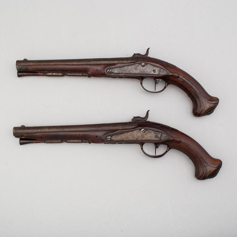 A pair of converted percussion pistols by Johan Franz Meidinger (Stockholm 1750-1769).