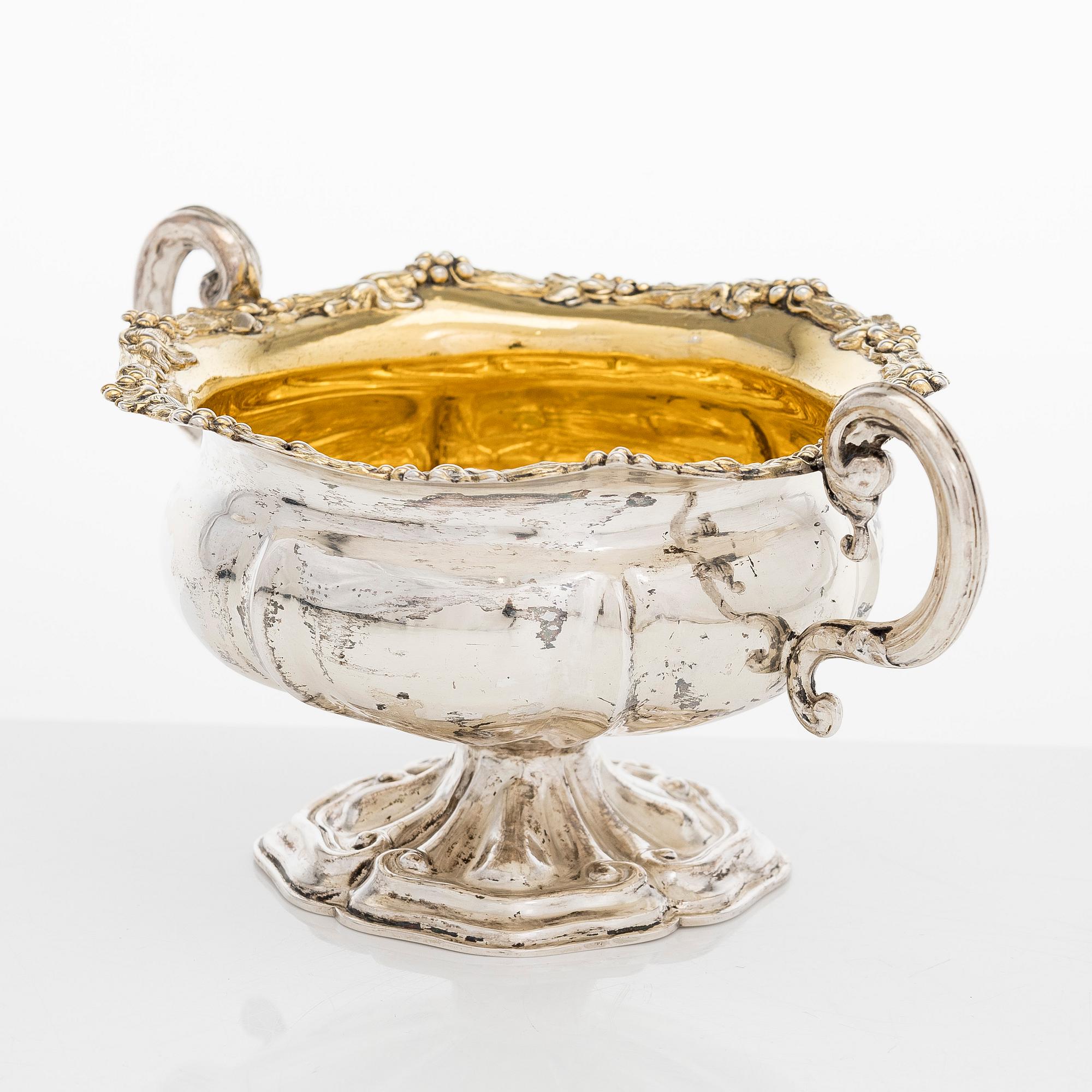 A silver sugar bowl, R. Mellin, Helsinki 1860, and two tea strainers, Kuopio and Porvoo, first half of the 19th century.