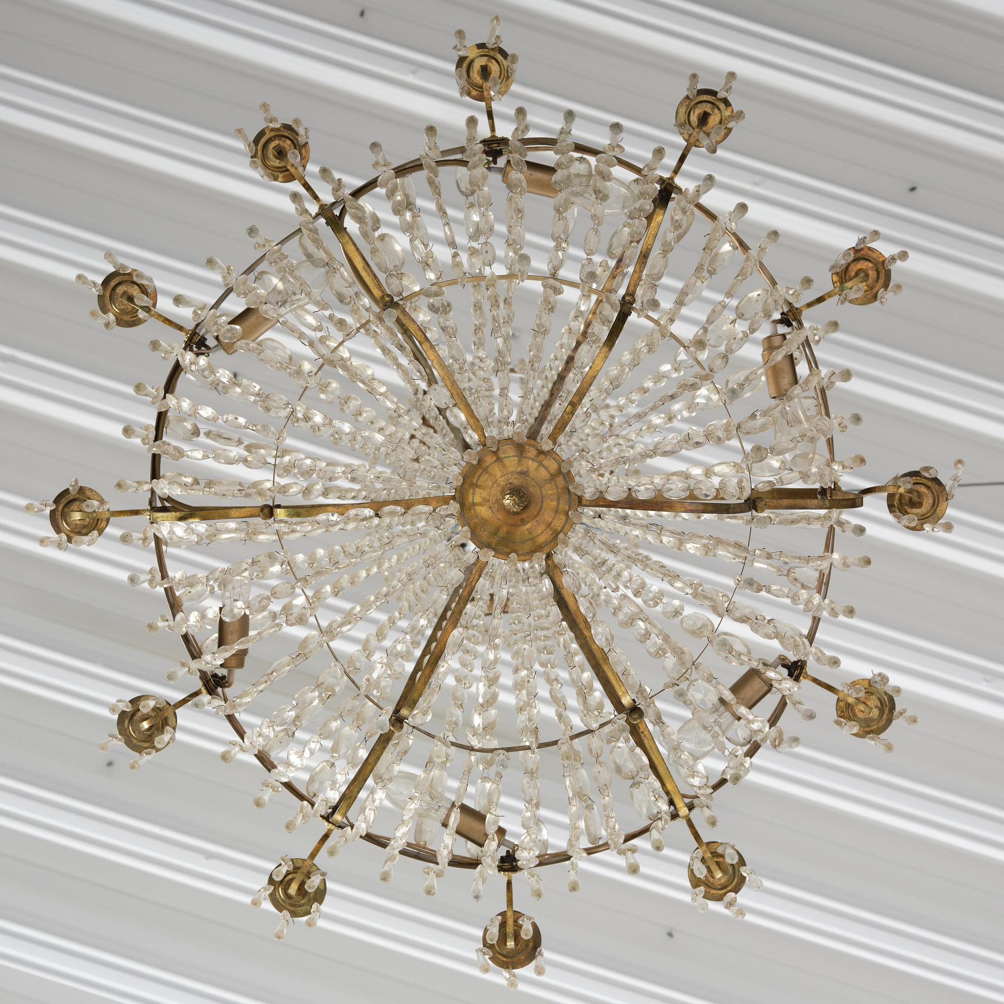 A Swedish gilt brass and cut glass thirteen-light Empire chandelier, early 19th century.