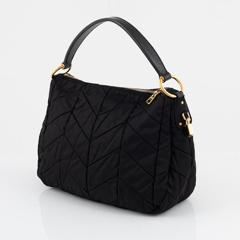 Prada, a black nylon bag.
