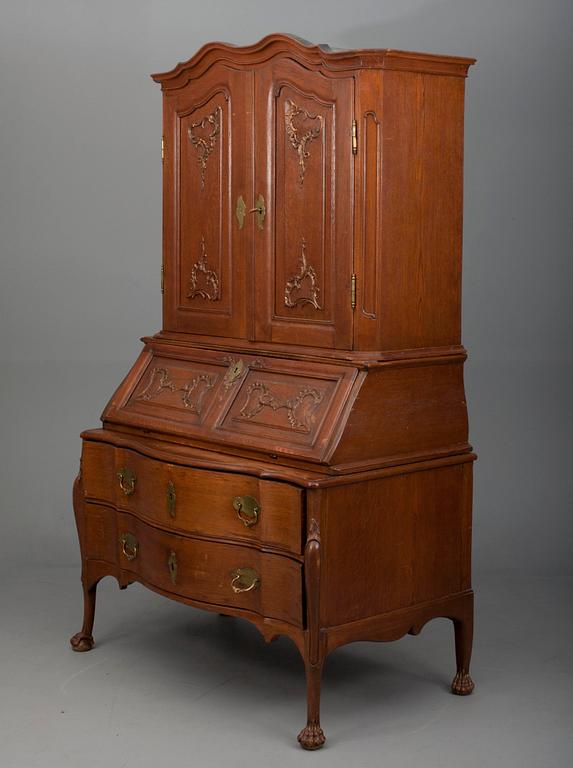 A TWO-PIECE WRITING CABINET.