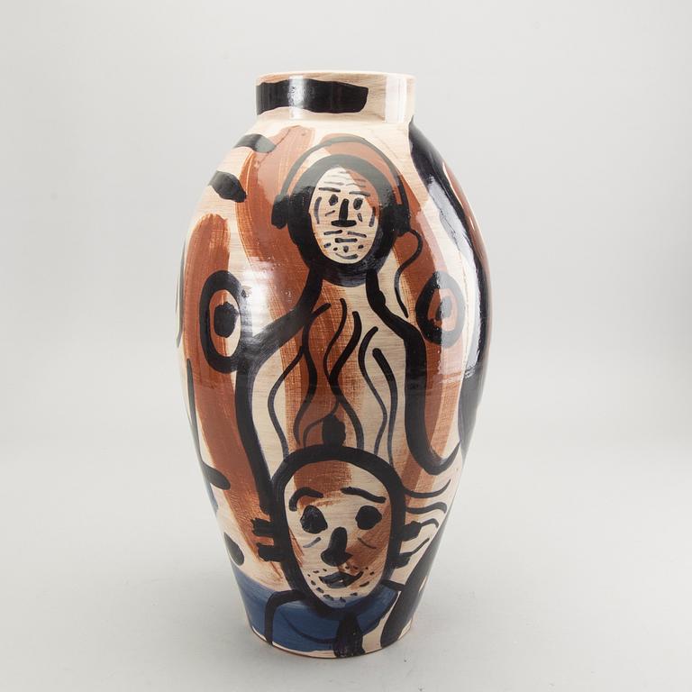 A glazed ceramic vase signed.