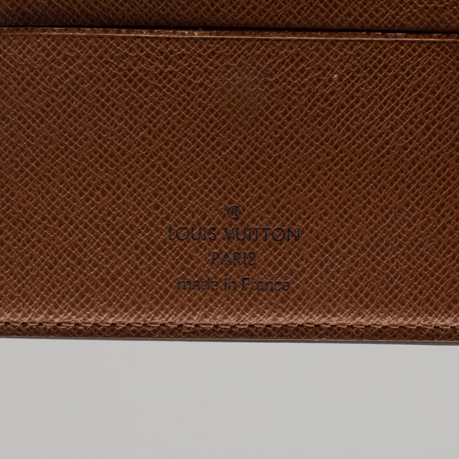 a LOUIS VUITTON 'Helene' wallet.