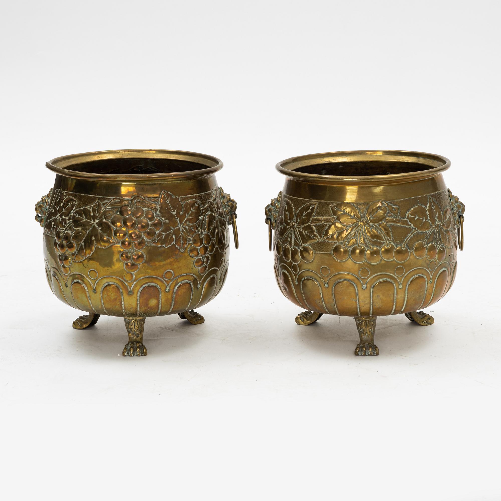 A pair of Baroque style brass plant pots, late 19th Century.