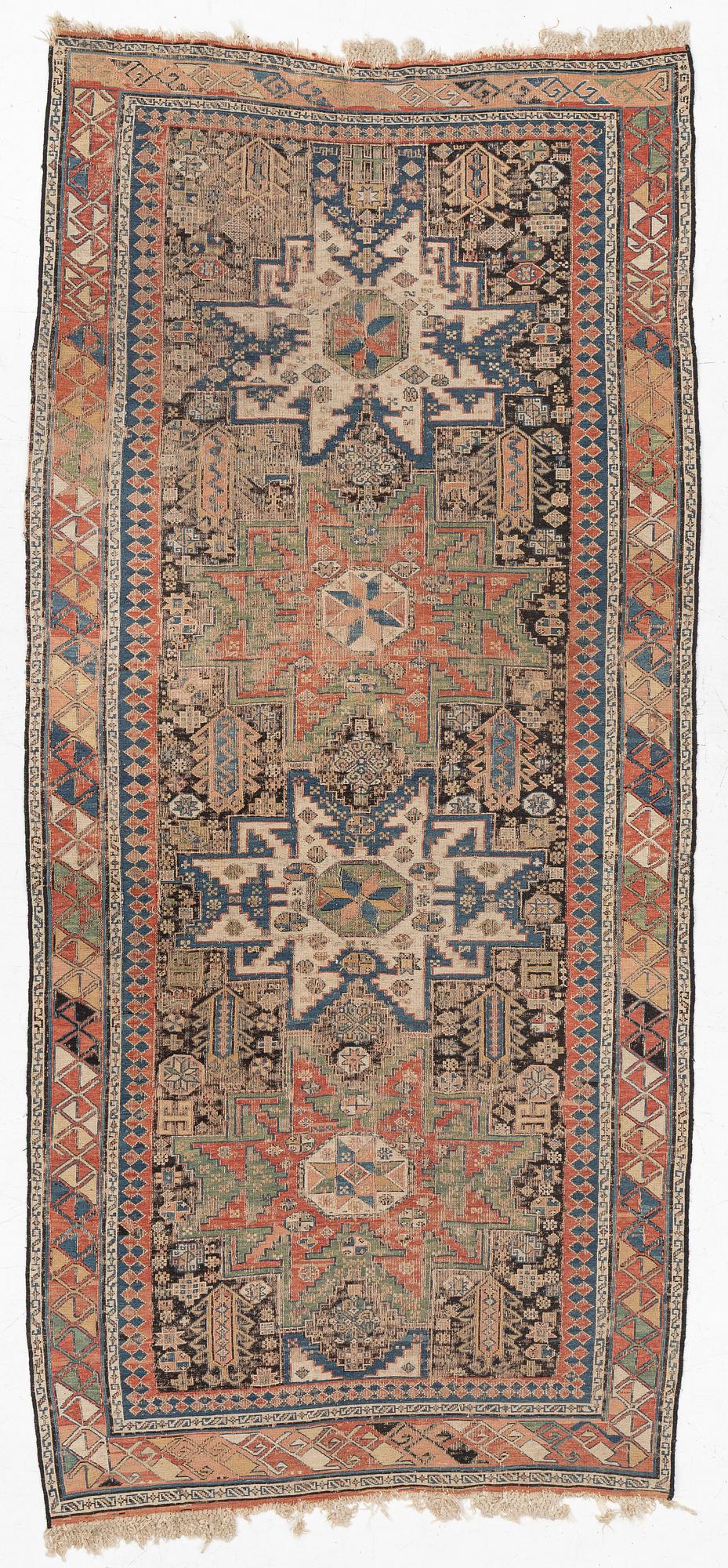 An oriental carpet, c 280 x 130 cm.
