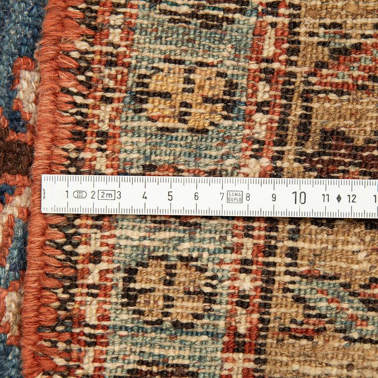 A Heriz runner, ca 310 x 85 cm.