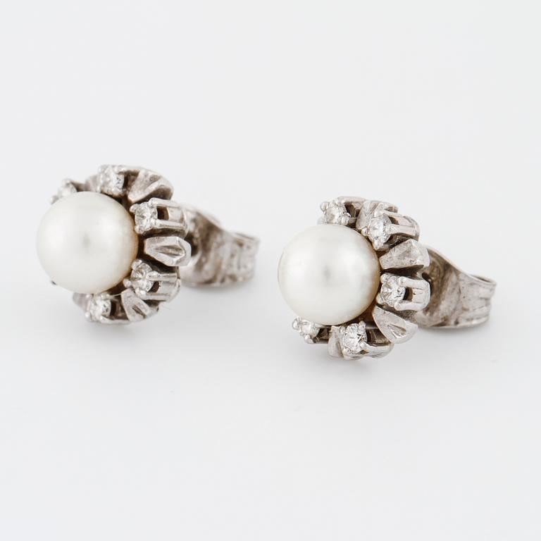 A pair of cultured pearl and brilliant cut diamond earrings.