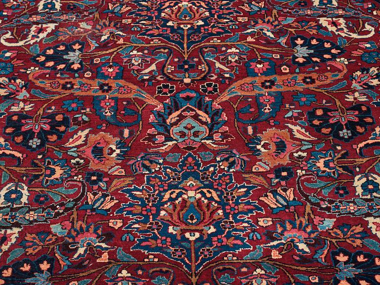 A CARPET, a semi-antique Mashad, ca 400-404 x 314 cm.