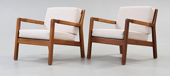 A pair of Carl Gustaf Hiort af Ornäs walnut armchairs, Finland 1950's.