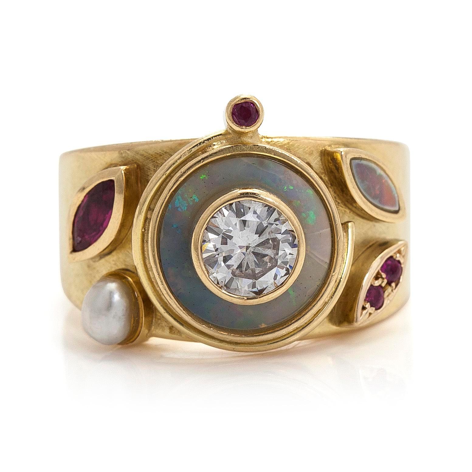 Ring, briljantslipad diamant, fasettslipade rubiner, opaler, pärla, 18K guld.