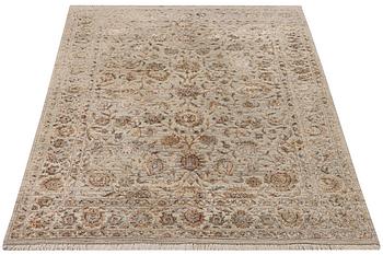 An Ushak Design, silk rug, a. 242 x 170 cm.