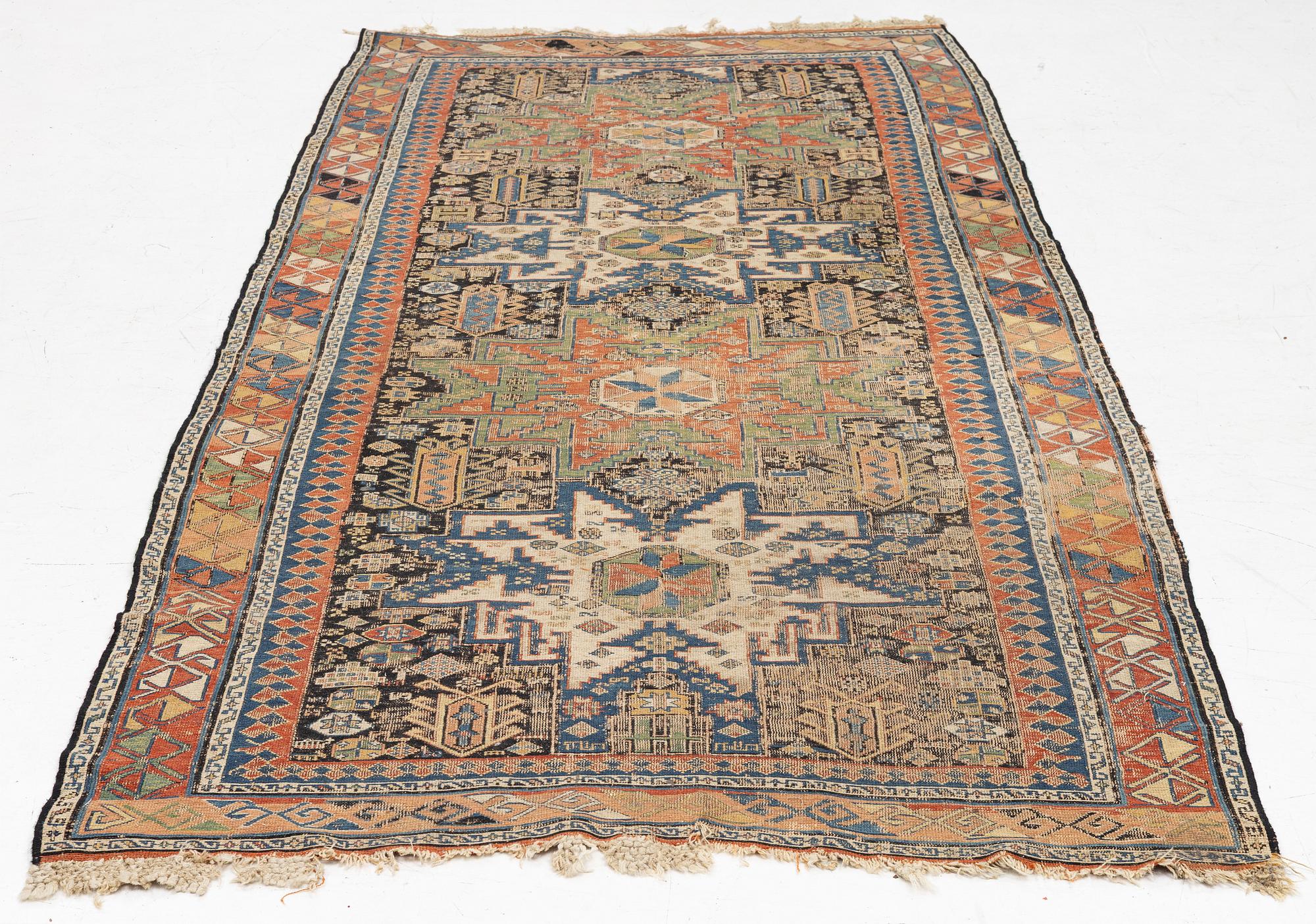 An oriental carpet, c 280 x 130 cm.