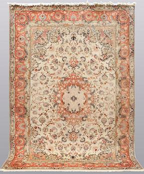 A carpet, Tabriz part silk, ca 302 x 200 cm.