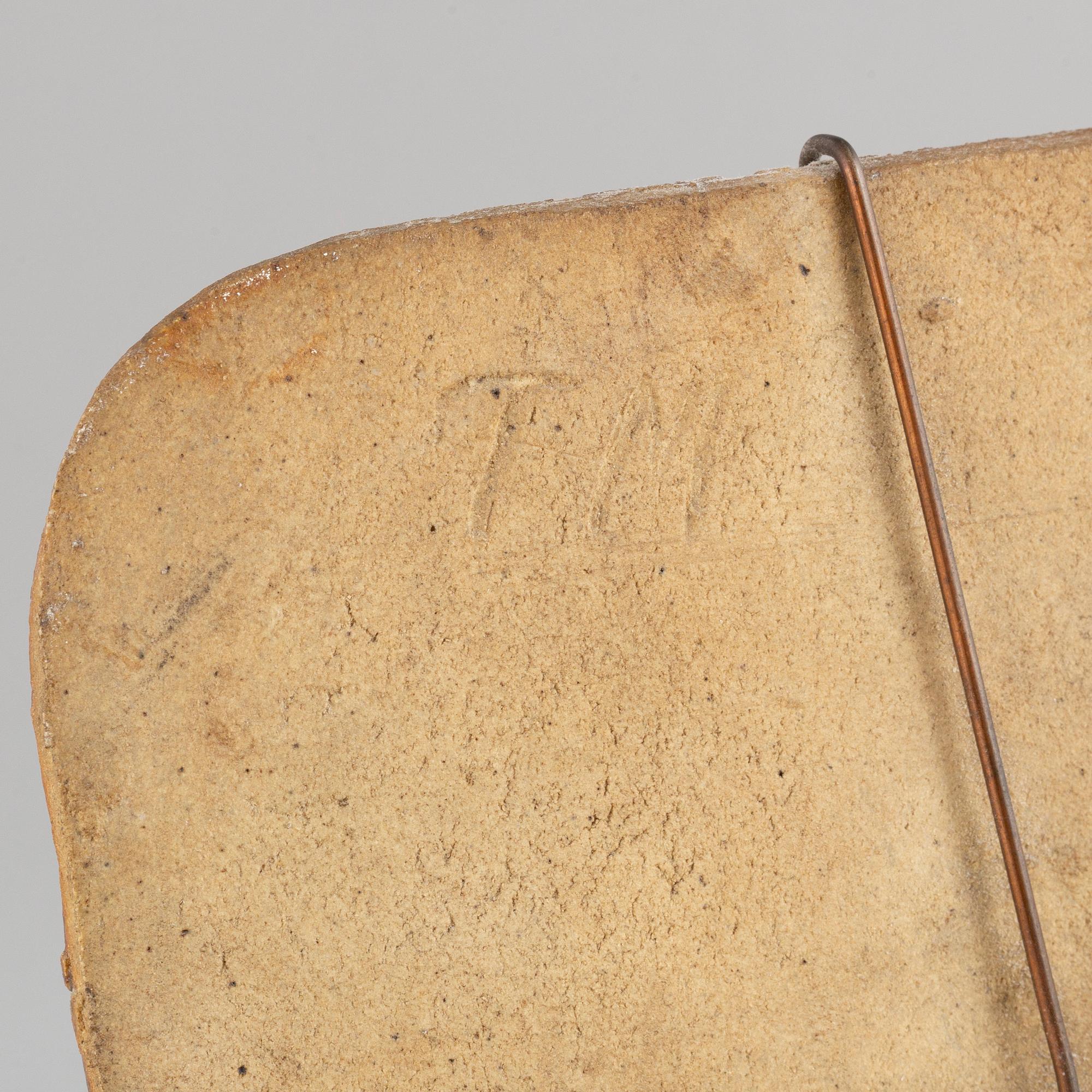 Toini Muona, a stoneware wall plaque, Finland, signed.